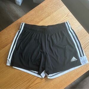 Adidas women’s Aeroready black shorts with white stripe, size medium.